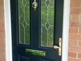 Coloured wood effect uPVC exterior door with diamond clear leaded glass style