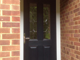 Coloured wood effect uPVC exterior door with diamond clear leaded glass style