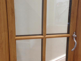 Interior view of double bullnose profile uPVC double glazed window with Victorian style hardware